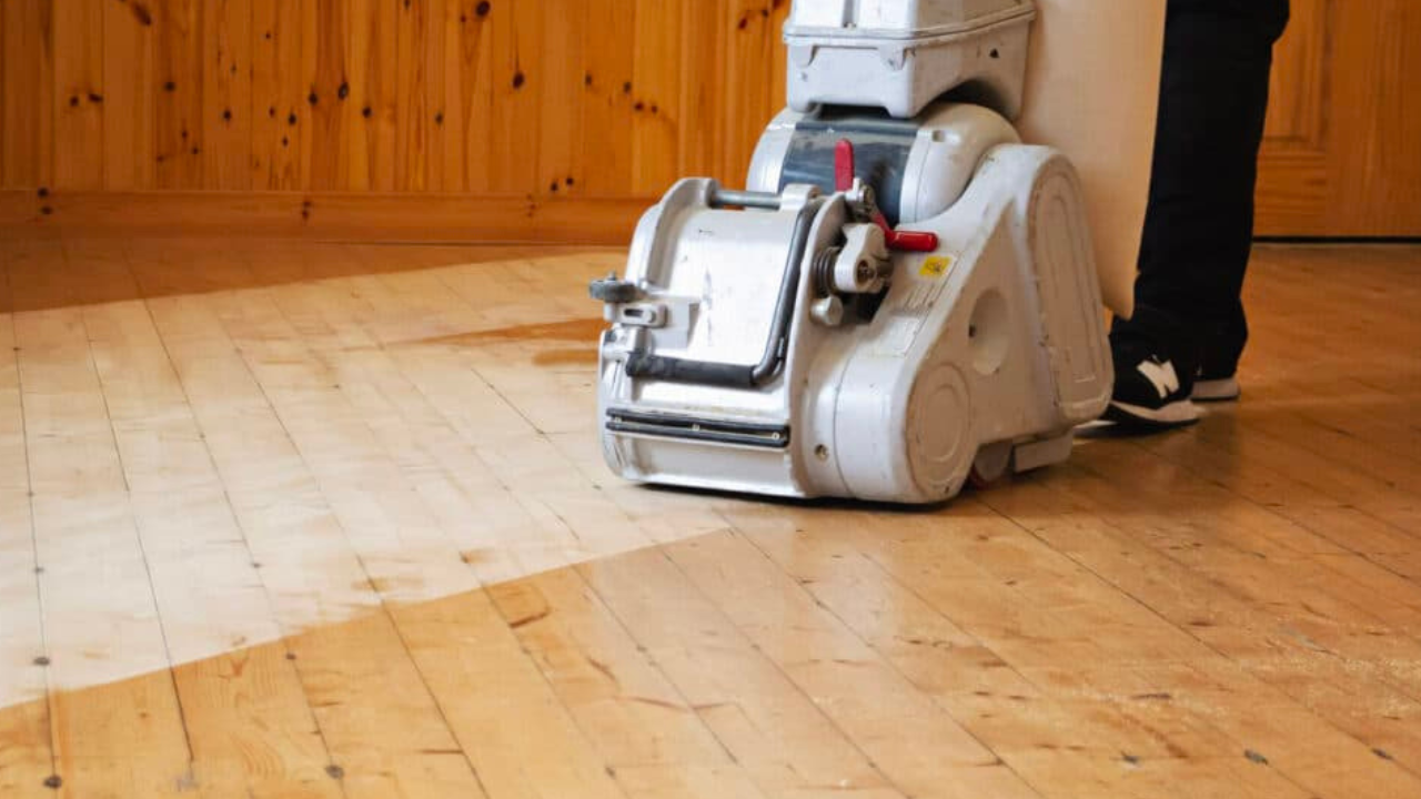  Floor-sanding machine gliding over Victorian pine boards in an Anerley home, transforming the surface into Beautifully Sanded Floors.
